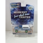 Greenlight 1:64 Ford F-250 1974 with Camper Shell Midwest Four Wheel Drive Center GREEN MACHINE